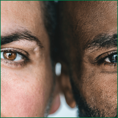 Two different ethnic men's eyes closeup