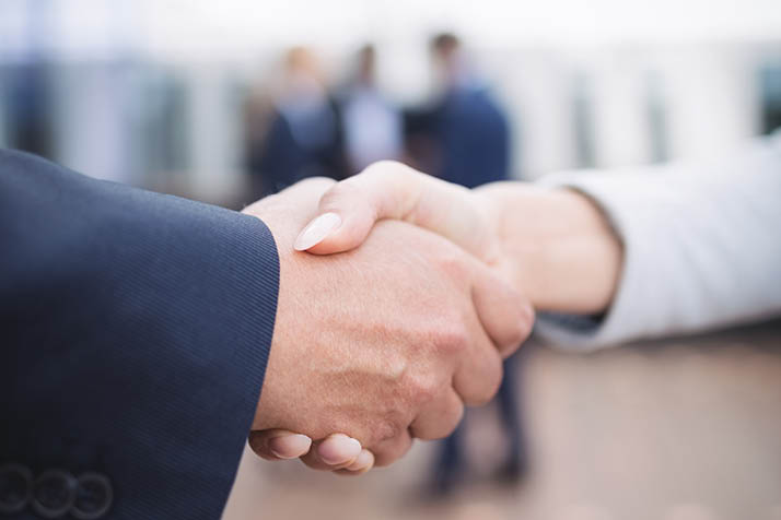 Close-up of businesspeople shaking hands