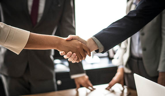 Business people shaking hands in a meeting room