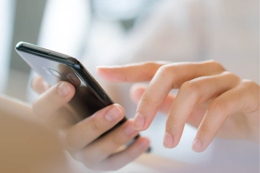 Business hand with mobile phone