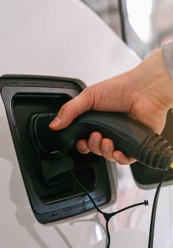 plugged-charger-into-electric-car-charge-station.jpg