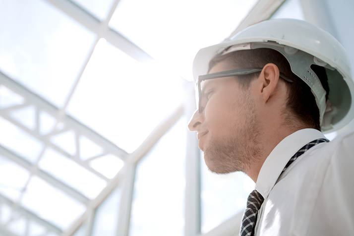 background image. young architect in an empty office.photo with copy space
